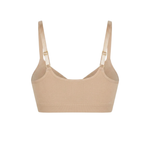 Seamless shaping bra with adjustable straps