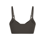 Seamless shaping bra with adjustable straps