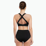 Sports bra with crossed straps